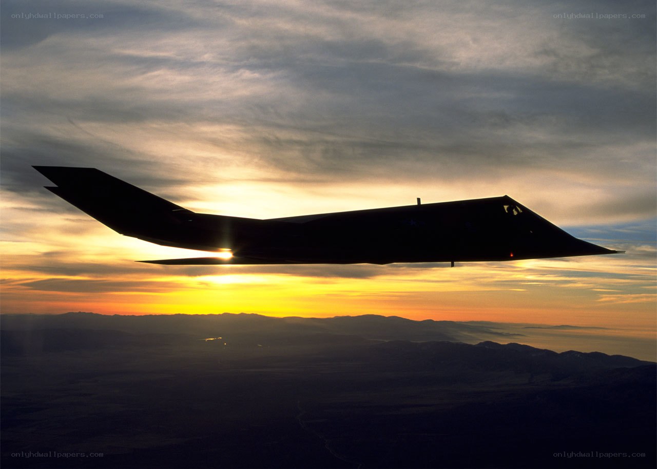 Stealth fighter at sunset