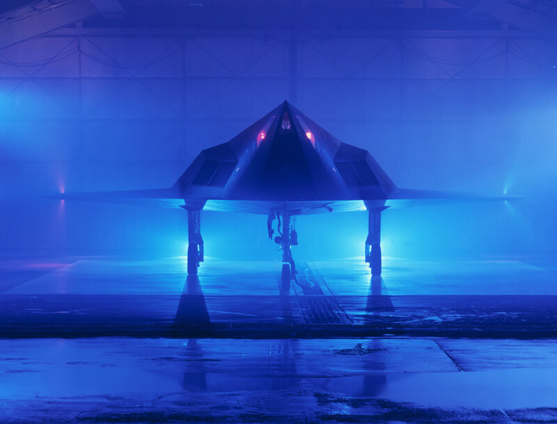 Stealth Fighter Jet — Blue, Dramatic, Photograph, Hangar, Lights