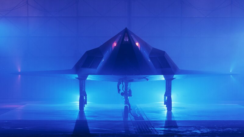 Stealth Fighter Jet — Blue, Dramatic, Photograph, Hangar