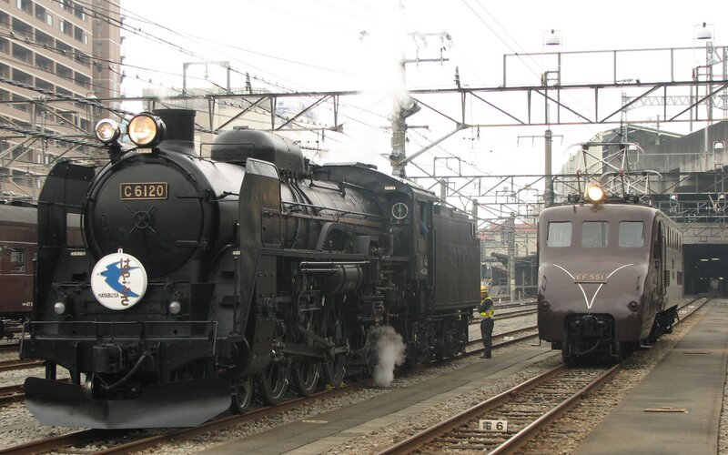 Steam and electric trains at station