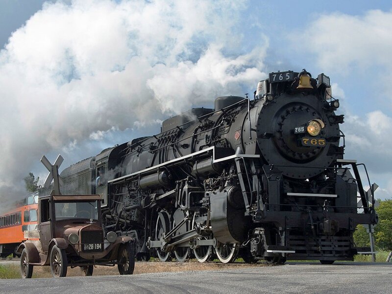 Steam locomotive and vintage car