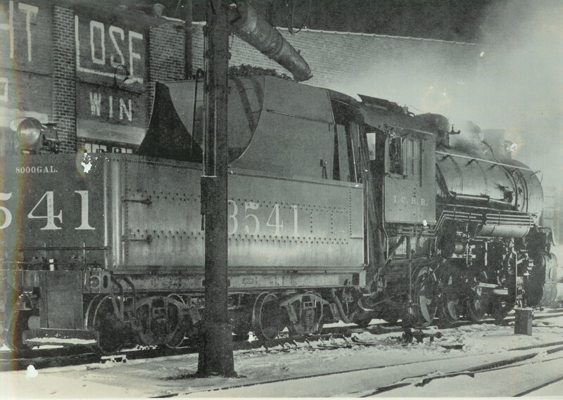 Steam locomotive at a rail yard