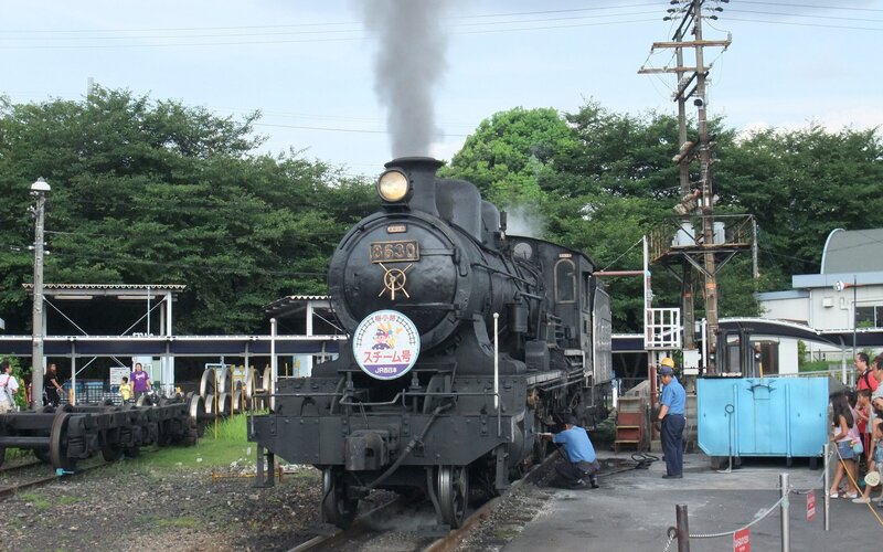 Steam locomotive at a station