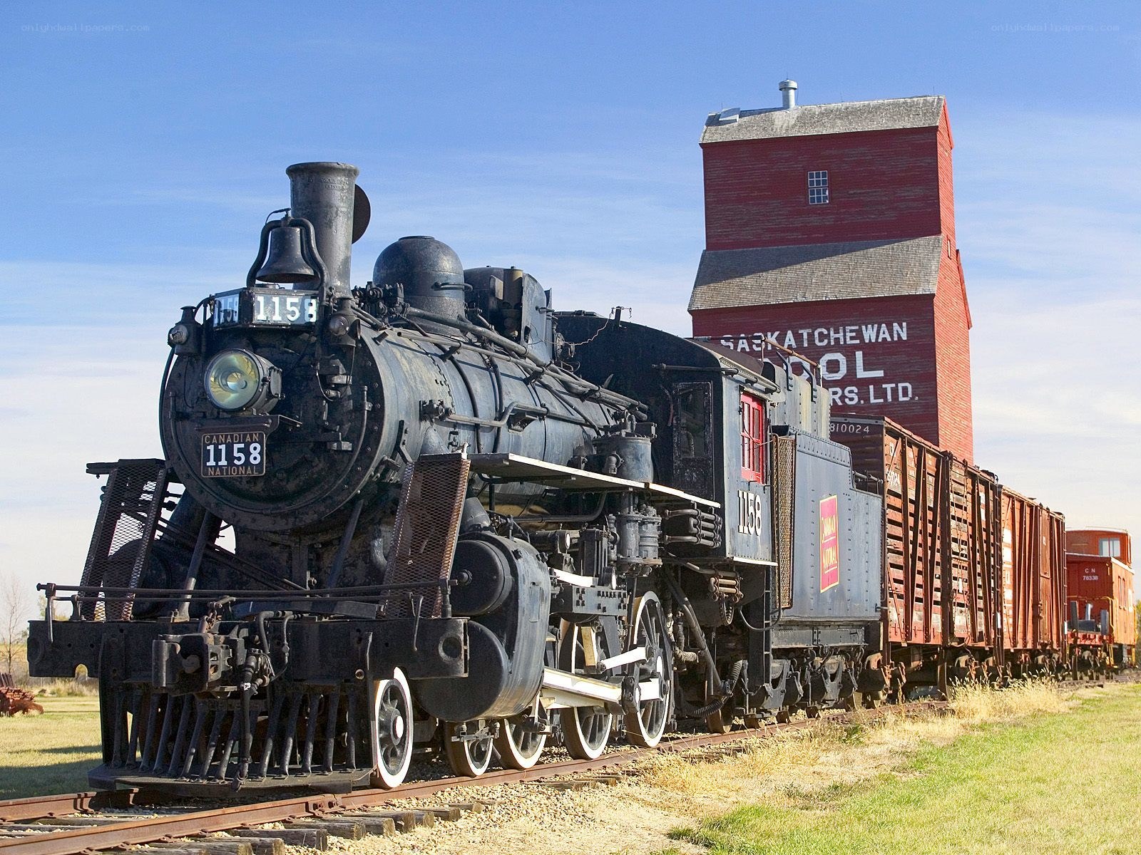 Steam locomotive at grain elevator
