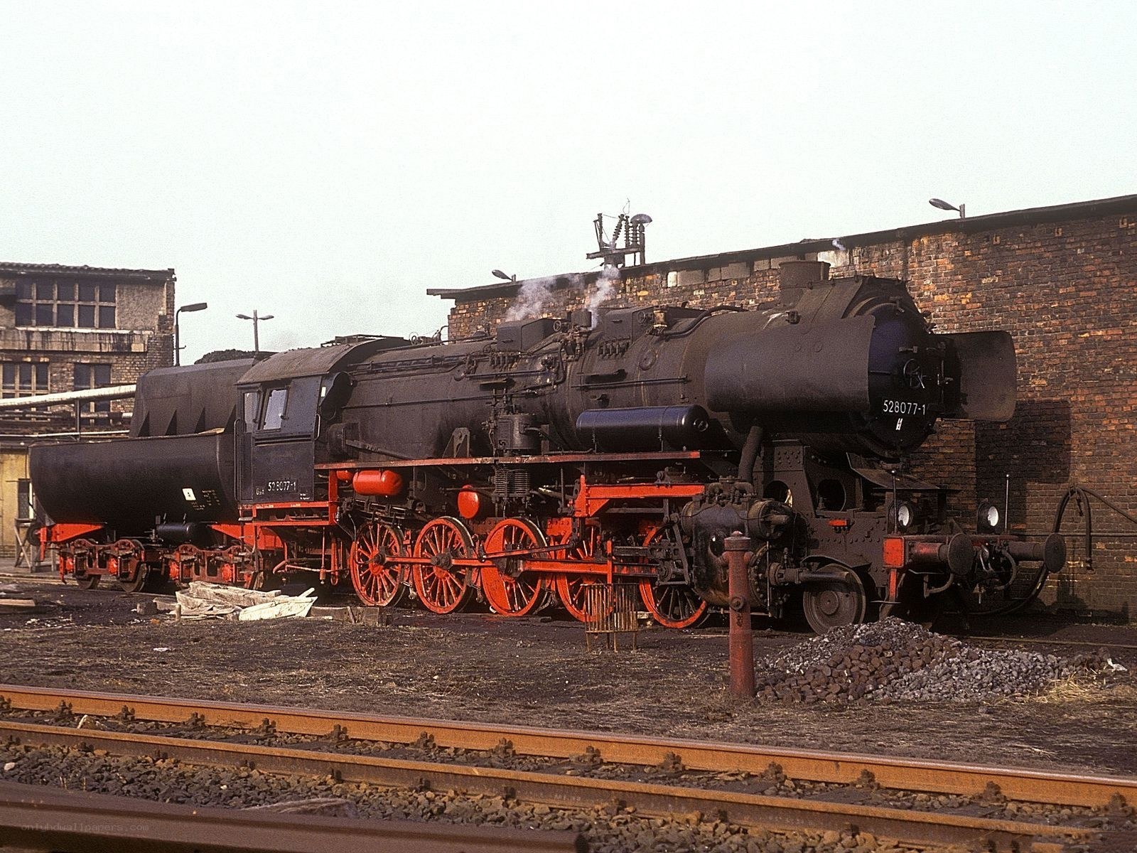 Steam locomotive at rail yard