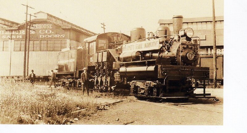 Steam locomotive at warehouse