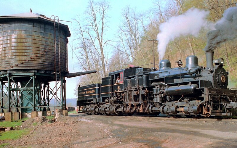 Steam locomotive at water tower