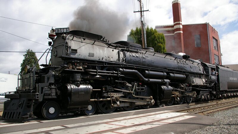 Steam Locomotive on Tracks — Black, Industrial, Afternoon, Photograph, Train, Building