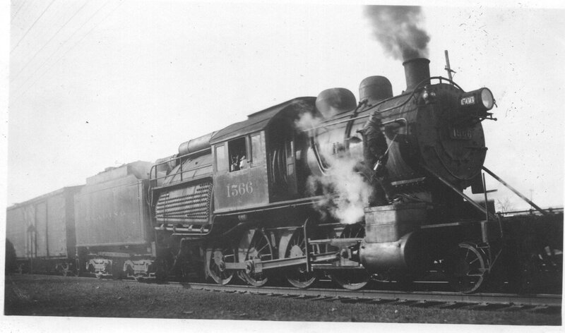 Steam locomotive pulling freight cars