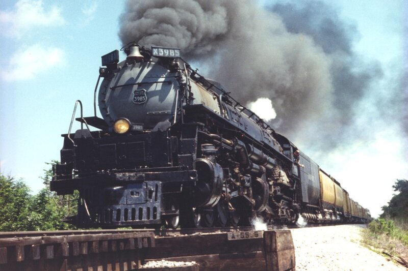 Steam locomotive pulling train