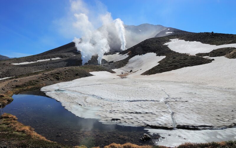 Steam rising from a volcanic crater