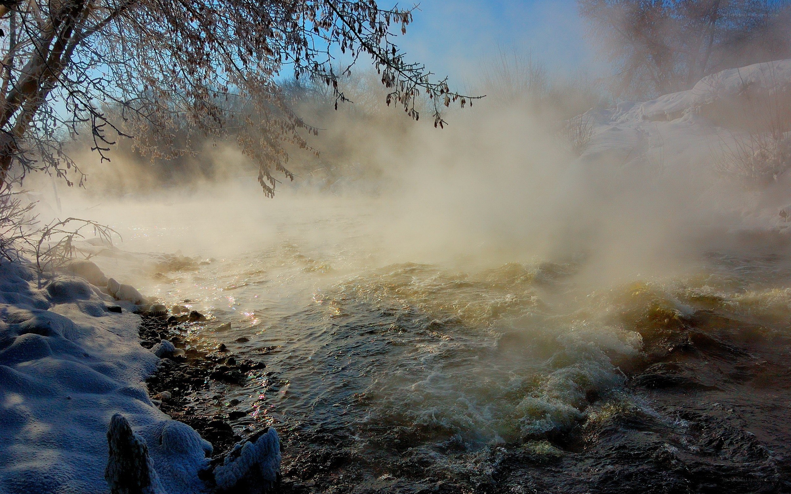 Steam rising from a winter river