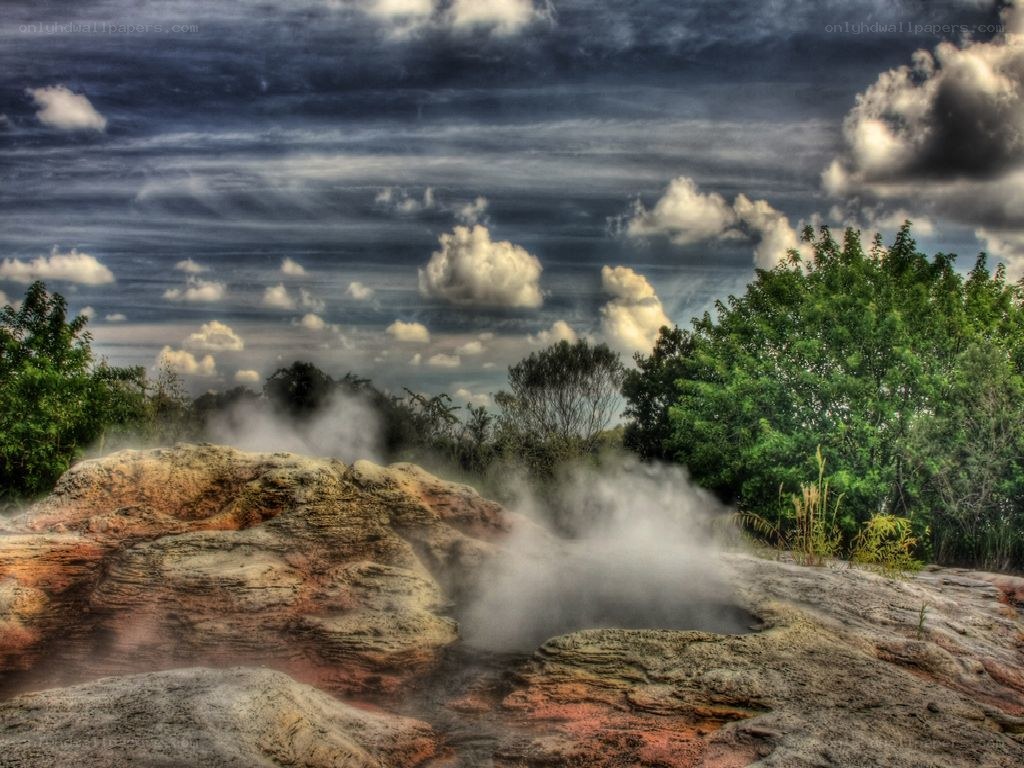 Steam rising from geothermal rocks