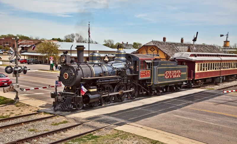 Steam train at a crossing