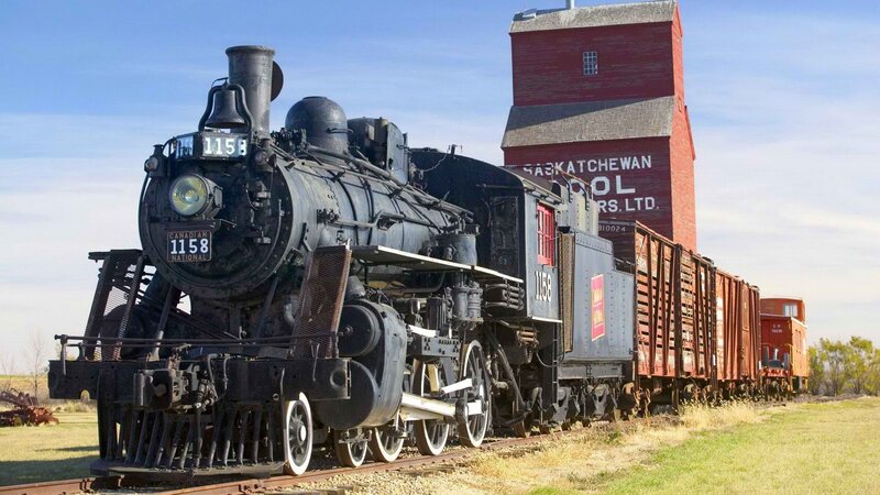 Steam train at a grain elevator