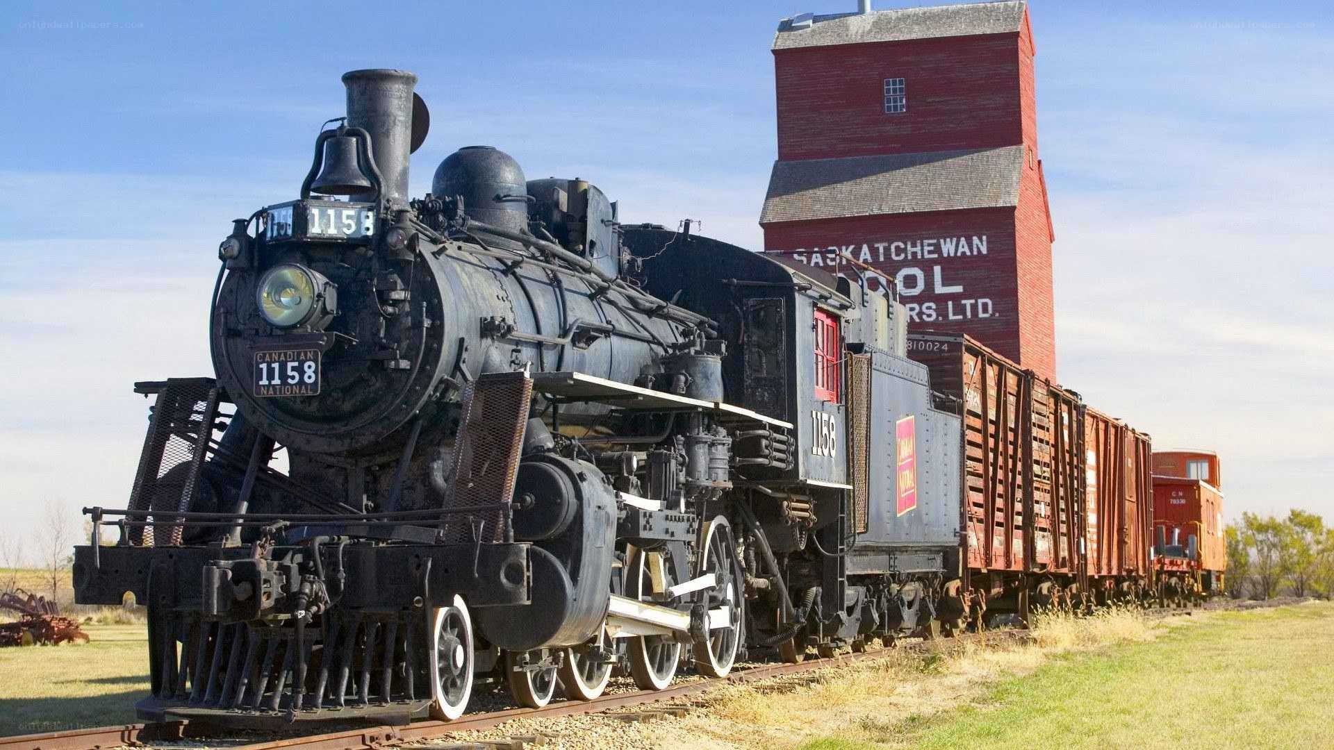 Steam train at a grain elevator