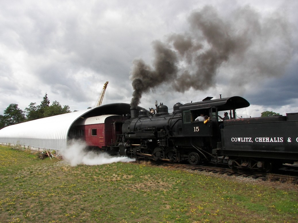 Steam train at a rail yard