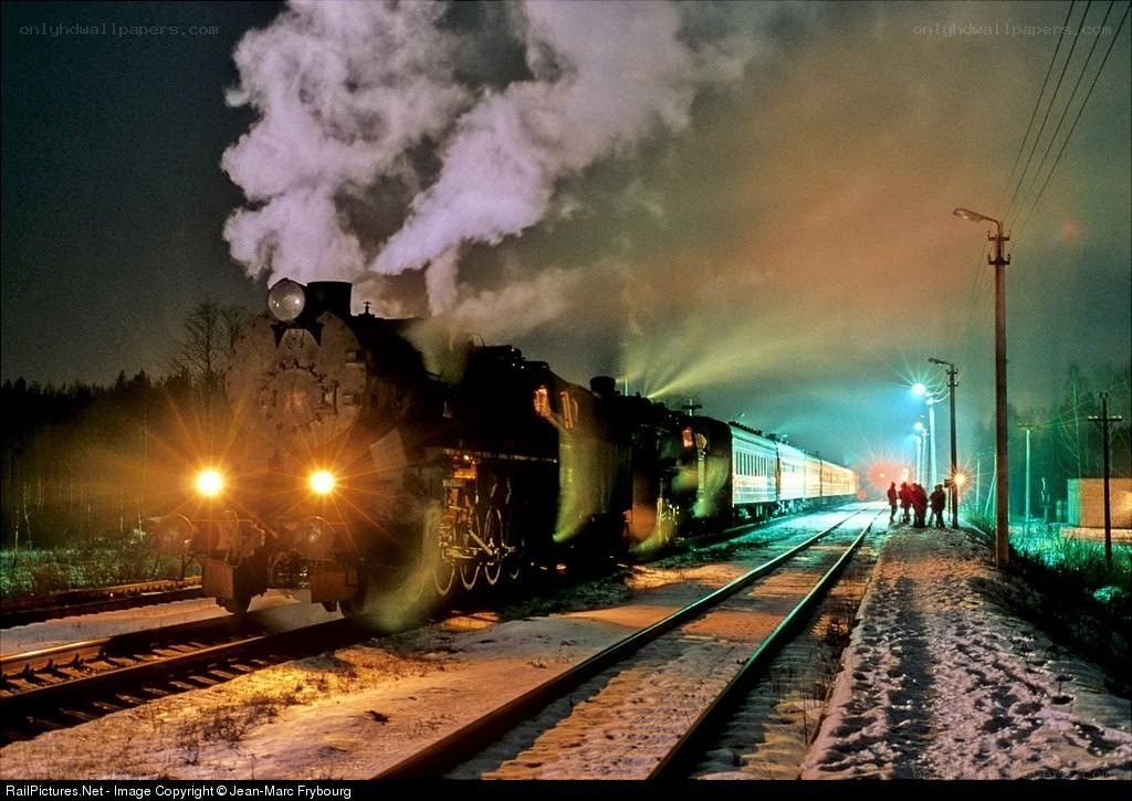 Steam train at night in snow