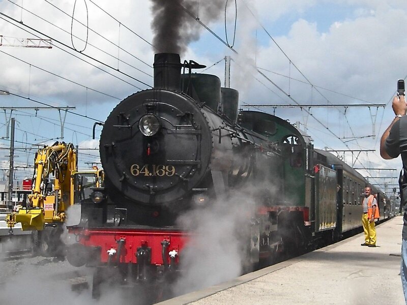 Steam Train at Station — Black, Industrial, Afternoon