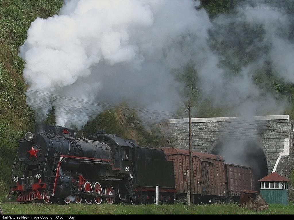 Steam train at tunnel entrance