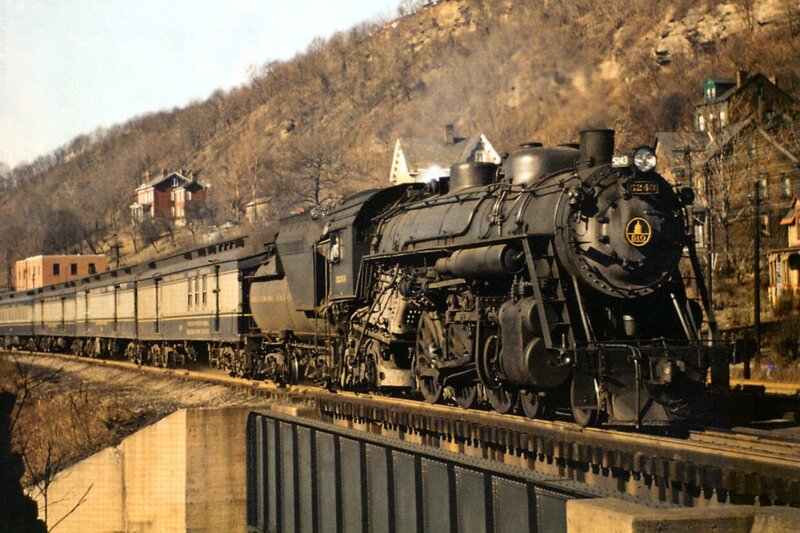 Steam train crossing a bridge