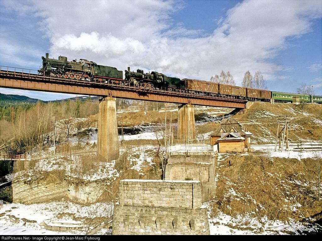 Steam train crossing a bridge
