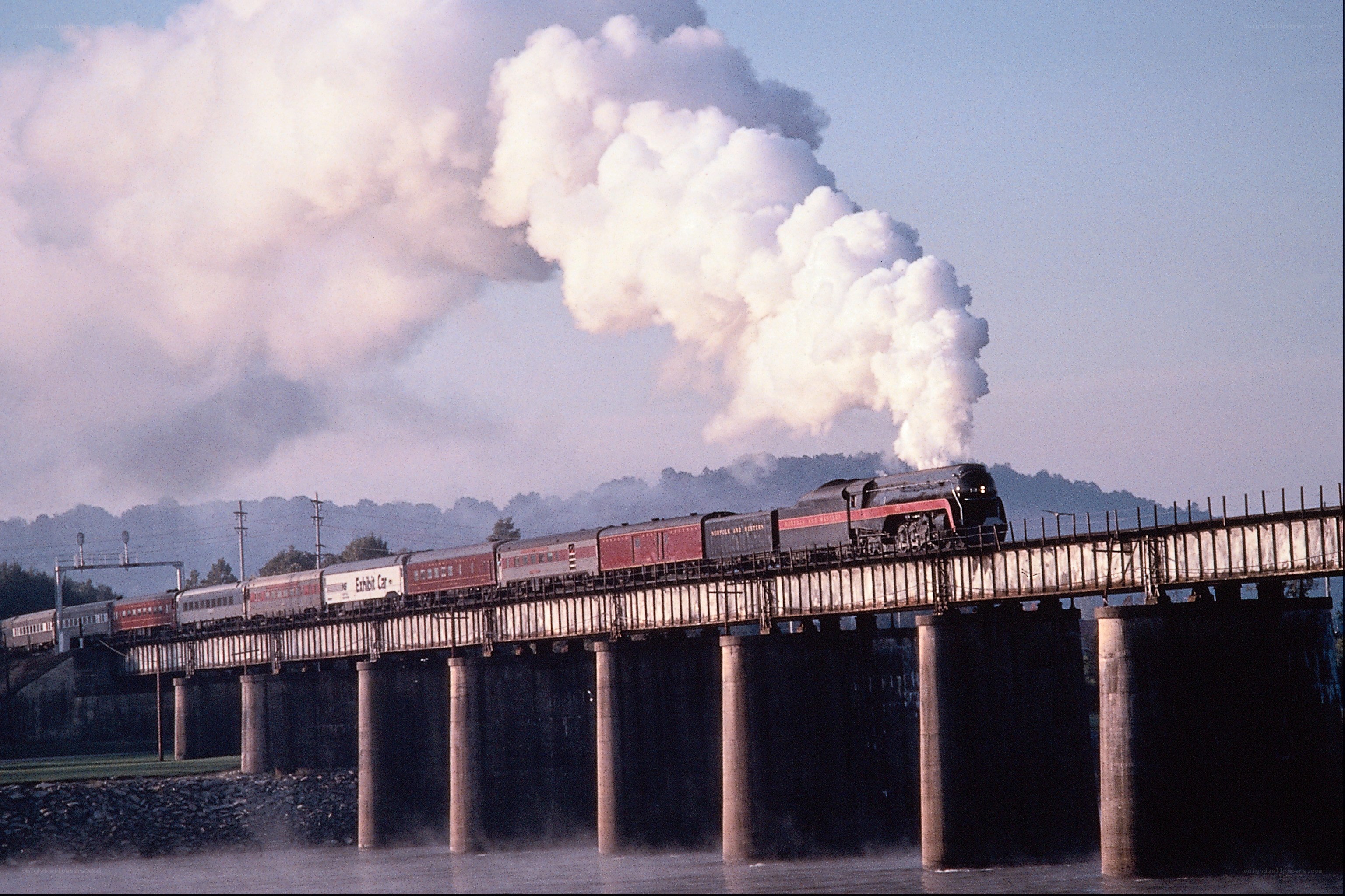 Steam train crossing bridge