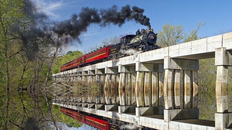 Steam train crossing bridge