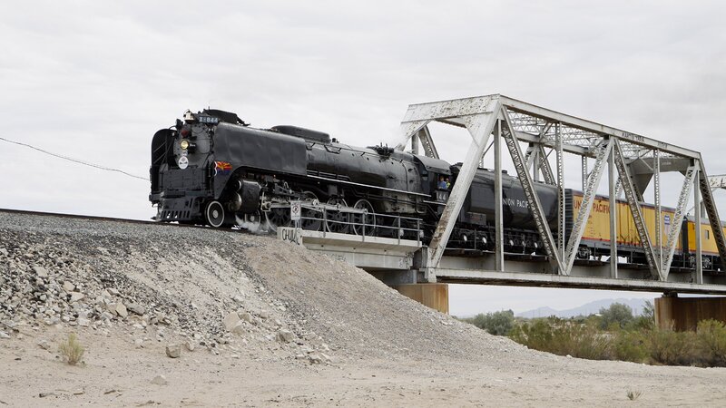 Steam train crossing bridge