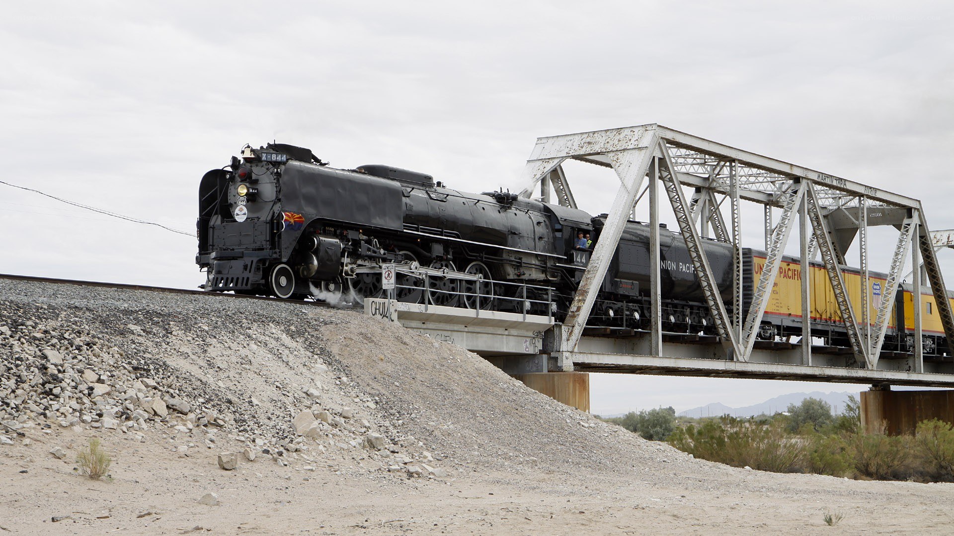 Steam train crossing bridge