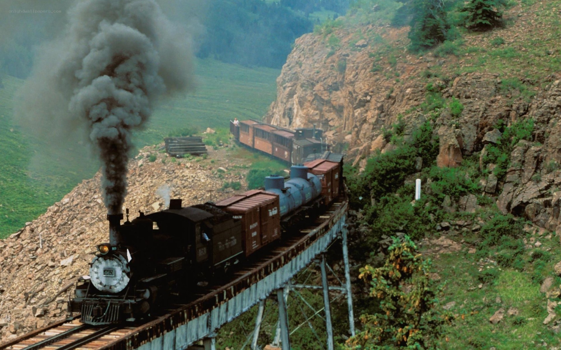 Steam train crossing bridge