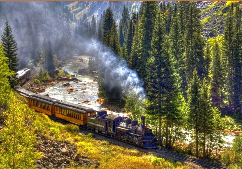 Steam train in a forest valley