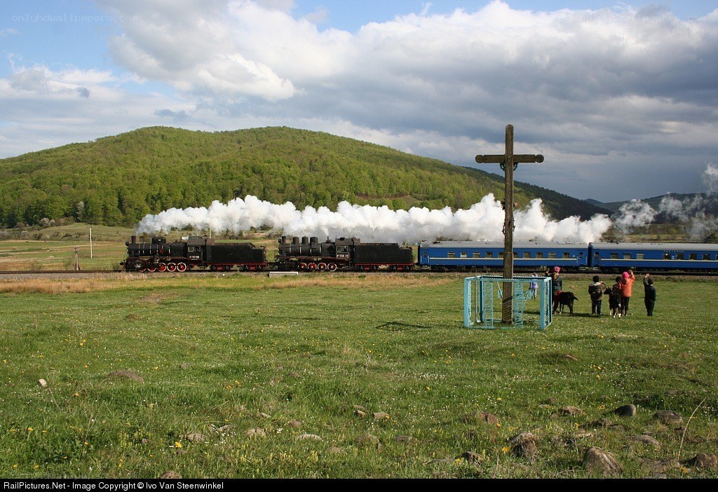 Steam train in a green valley
