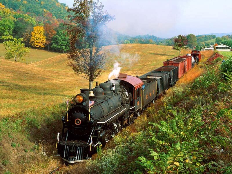 Steam train in autumn countryside