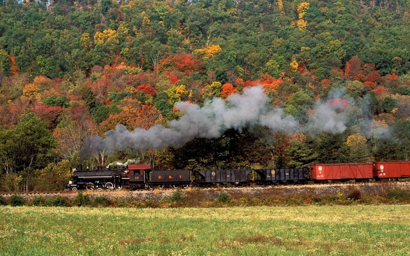 Steam train in autumn foliage