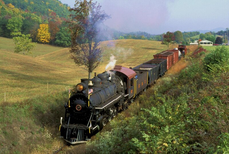Steam train in autumn hills