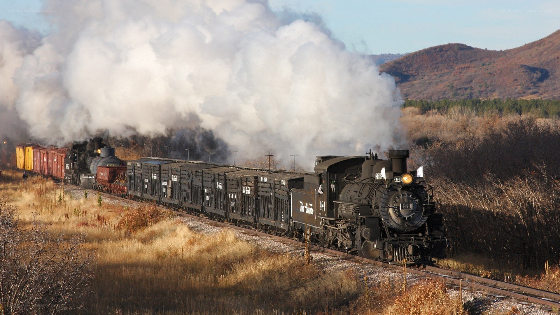Steam train in autumn landscape