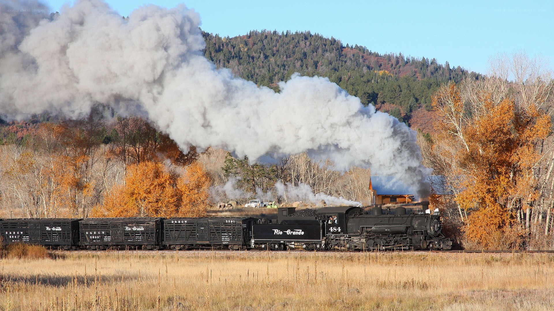 Steam train in autumn landscape