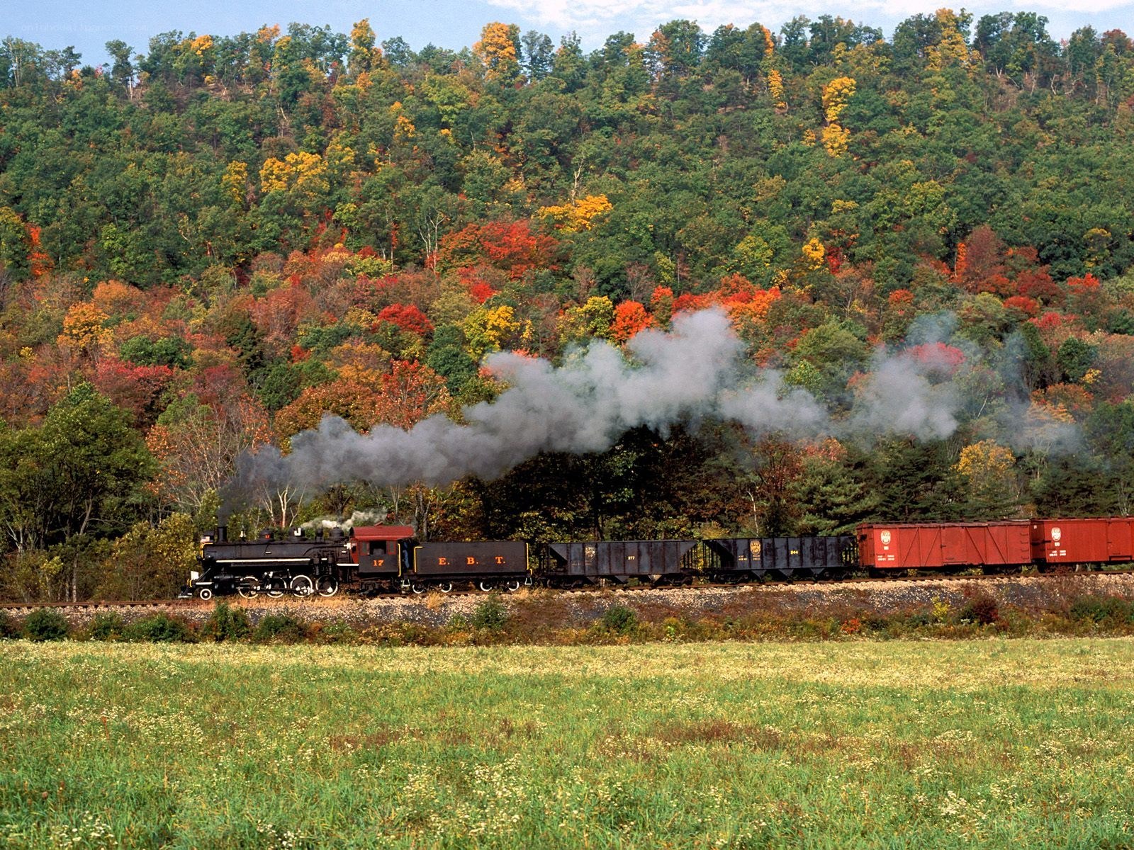 Steam train in autumn scenery
