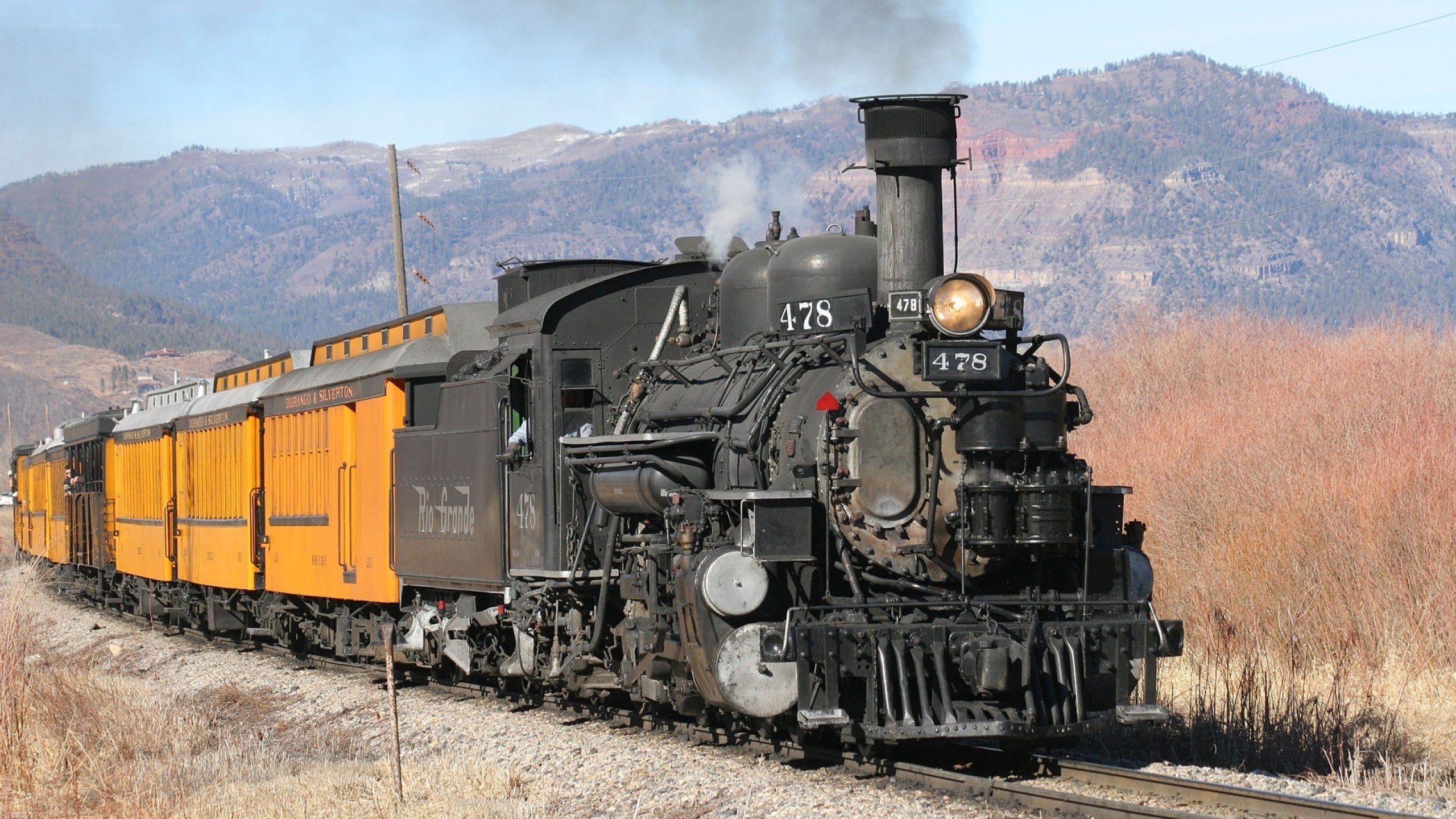 Steam train in mountain landscape