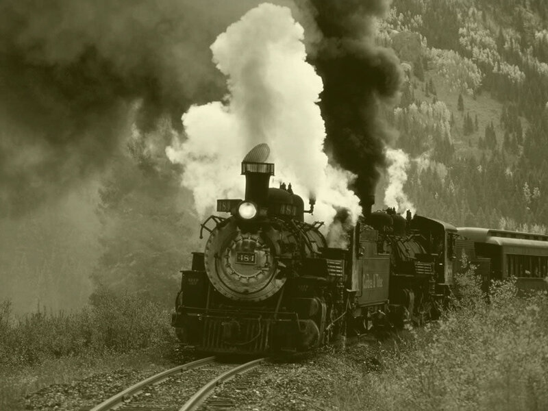 Steam train in mountain landscape