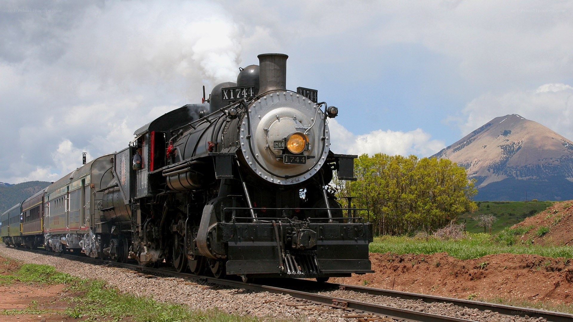 Steam train in mountain landscape