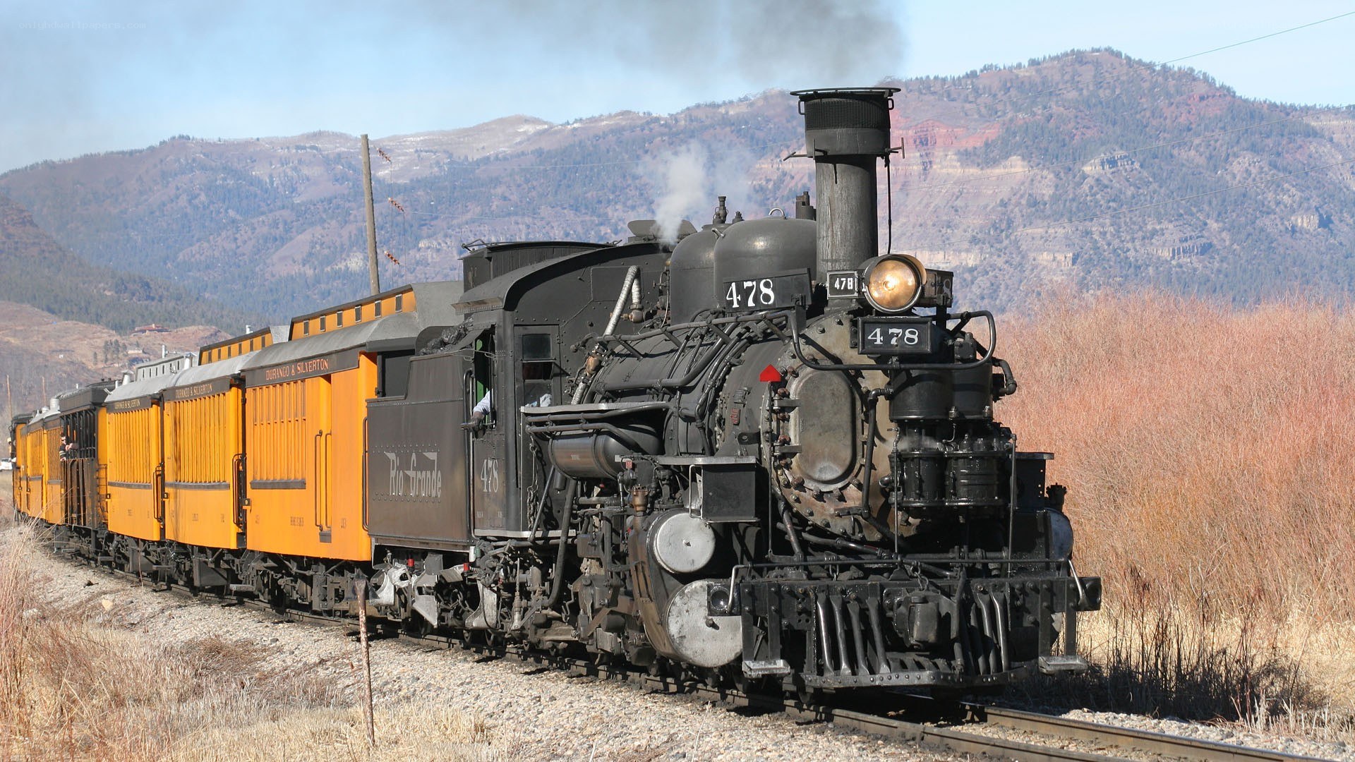 Steam train in mountain landscape