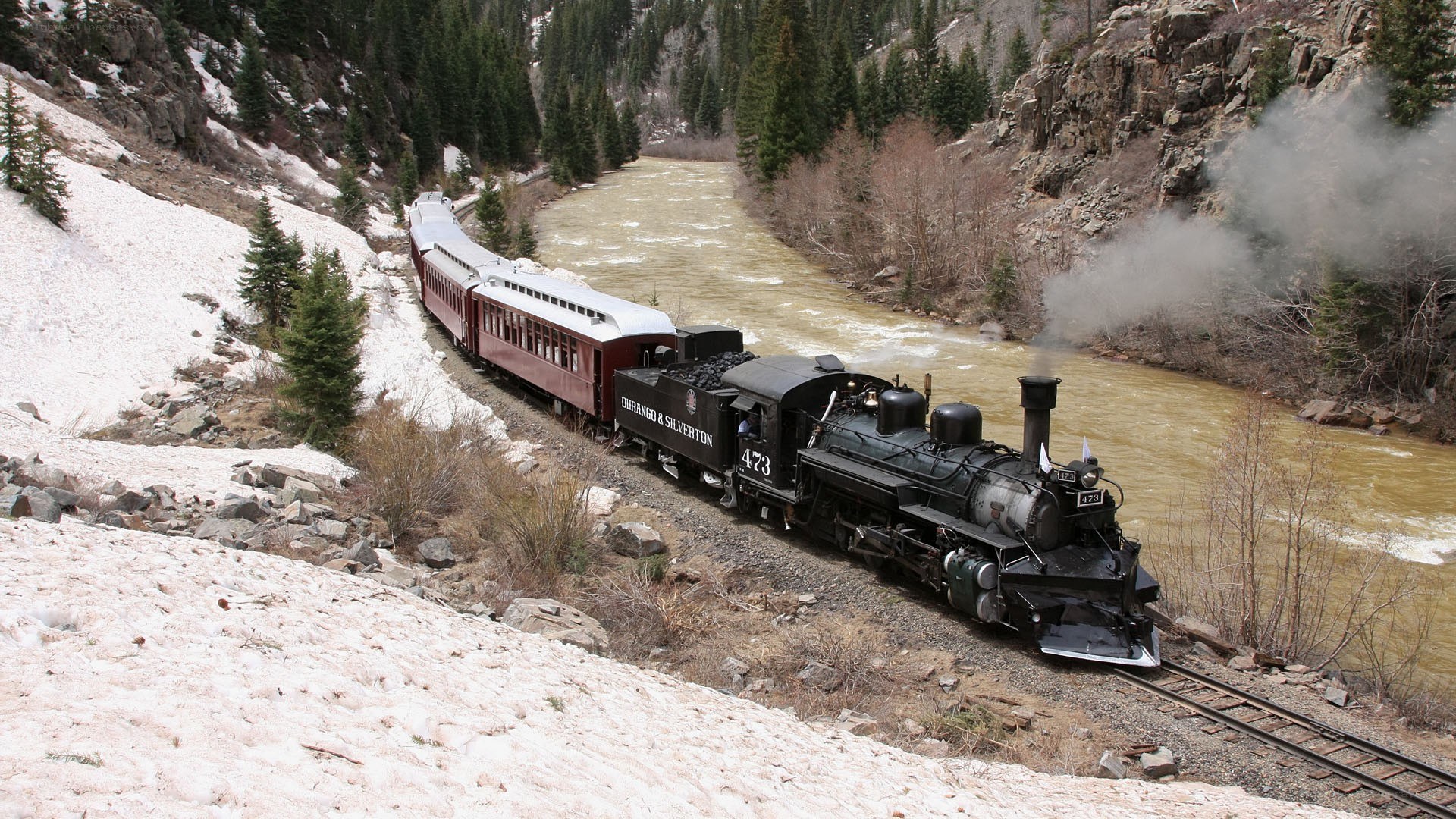 Steam train in mountain valley