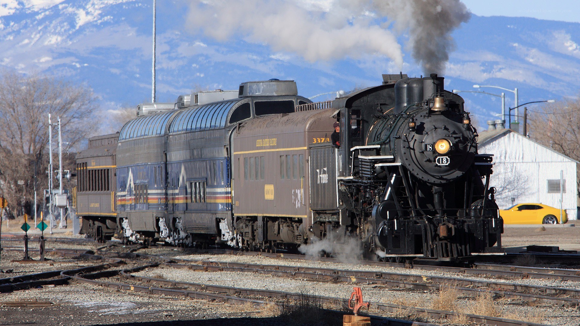 Steam train in mountain valley