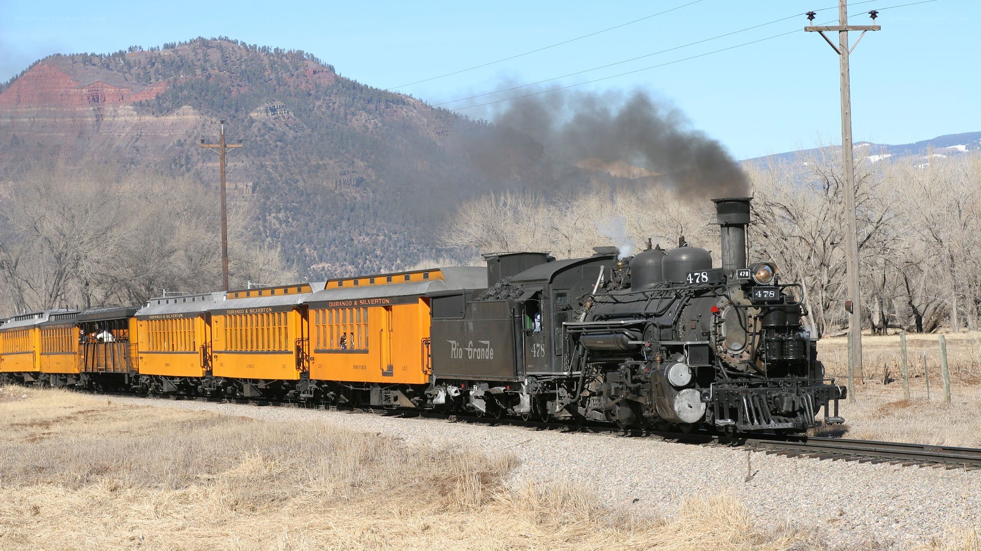 Steam train in mountain valley