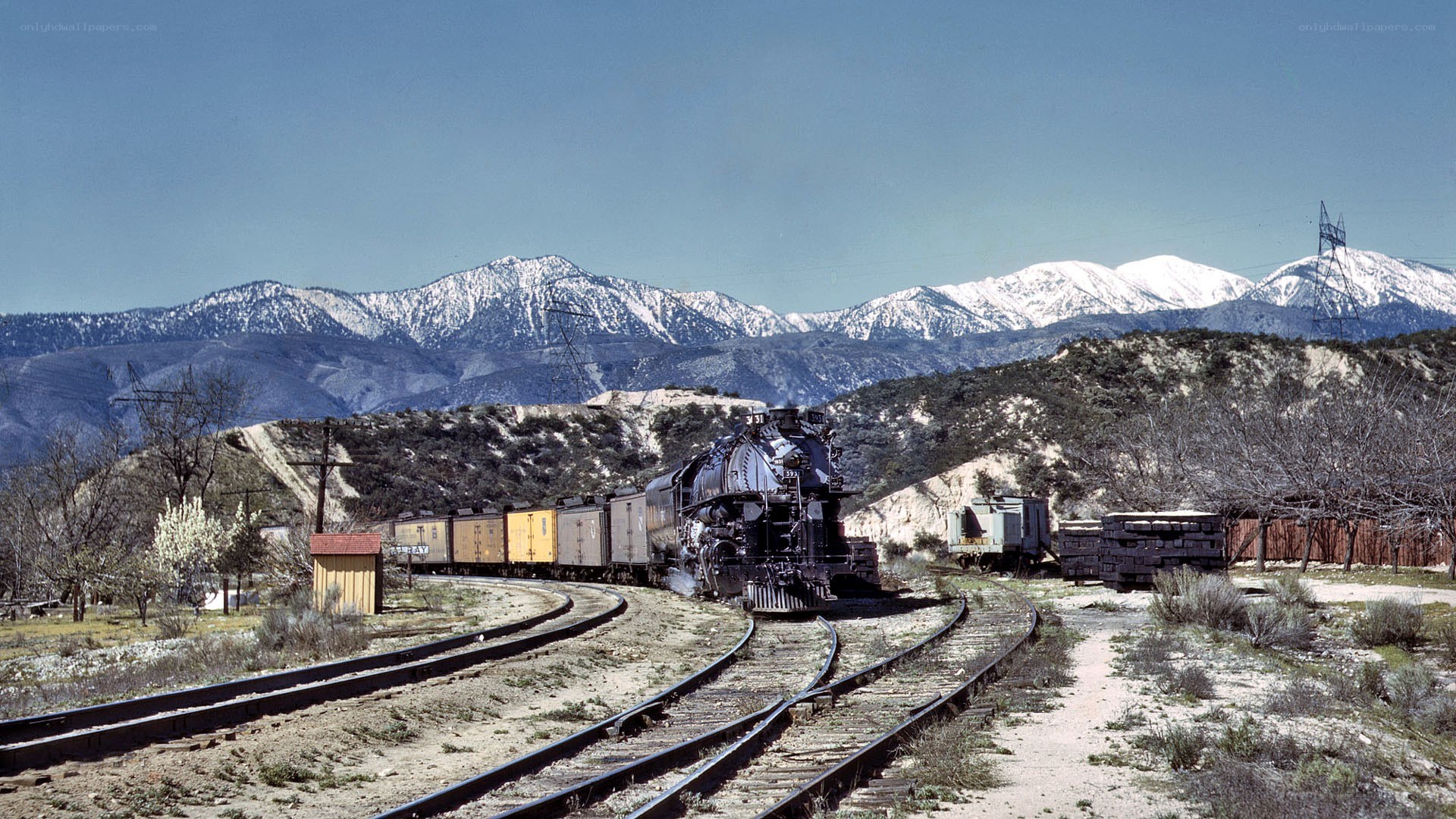 Steam train in mountain valley