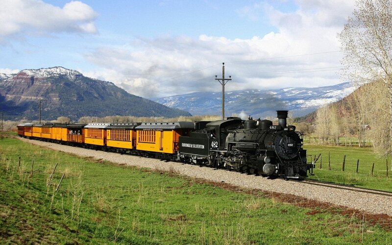 Steam train in mountain valley