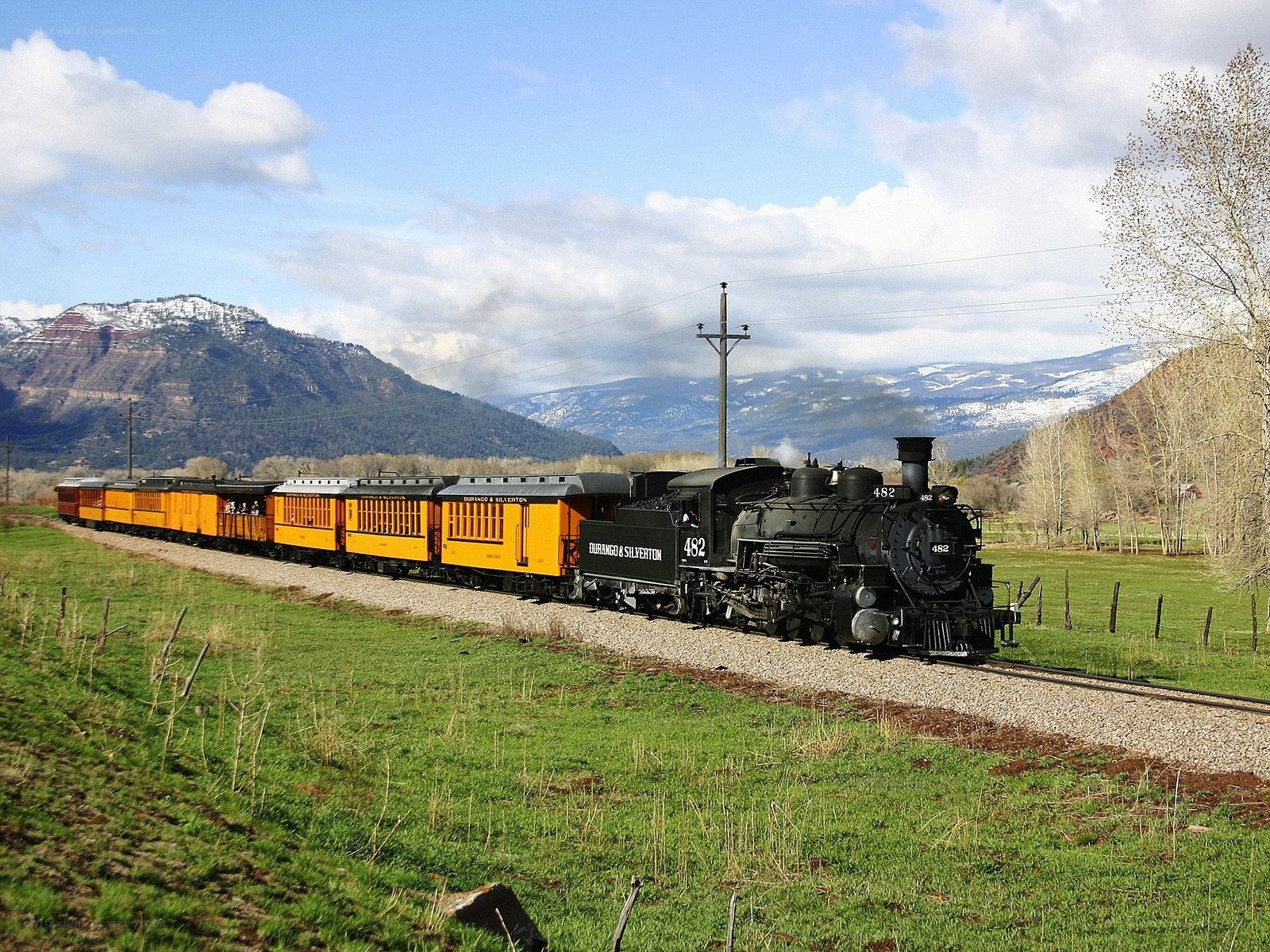 Steam train in mountain valley