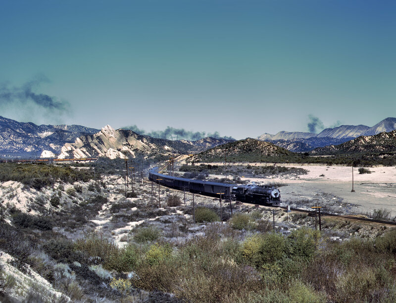 Steam train in mountain valley